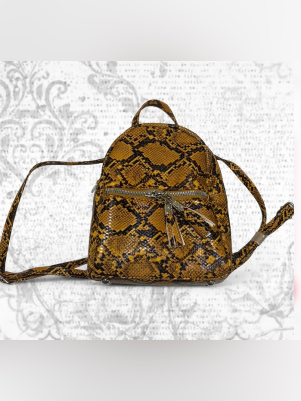 Snake-Print Mini Backpack in Mustard Yellow